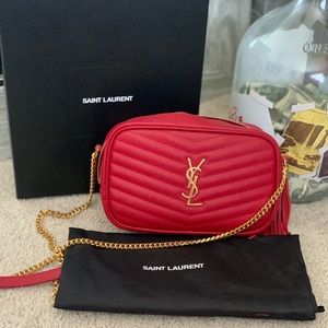 Saint Laurent Monogram mini bag decorated with metal YSL initials.